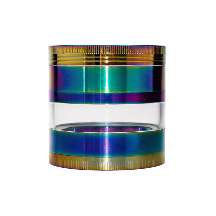 "Anodized four-piece grinder with a see-through body to view grinded herbs on a white background," - Up N Smoke. 