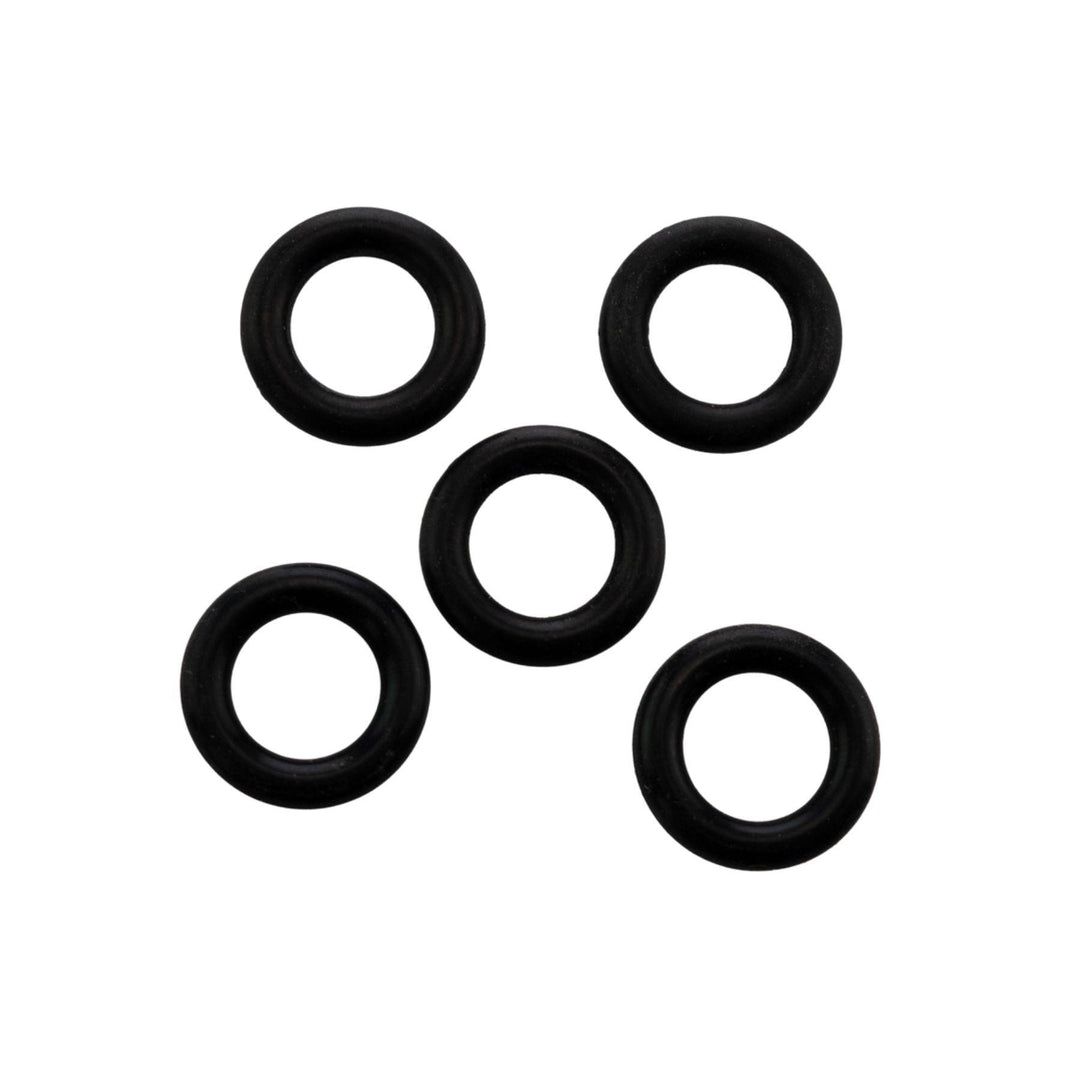 "Five black rubber o-rings on a white background," - Up N Smoke.