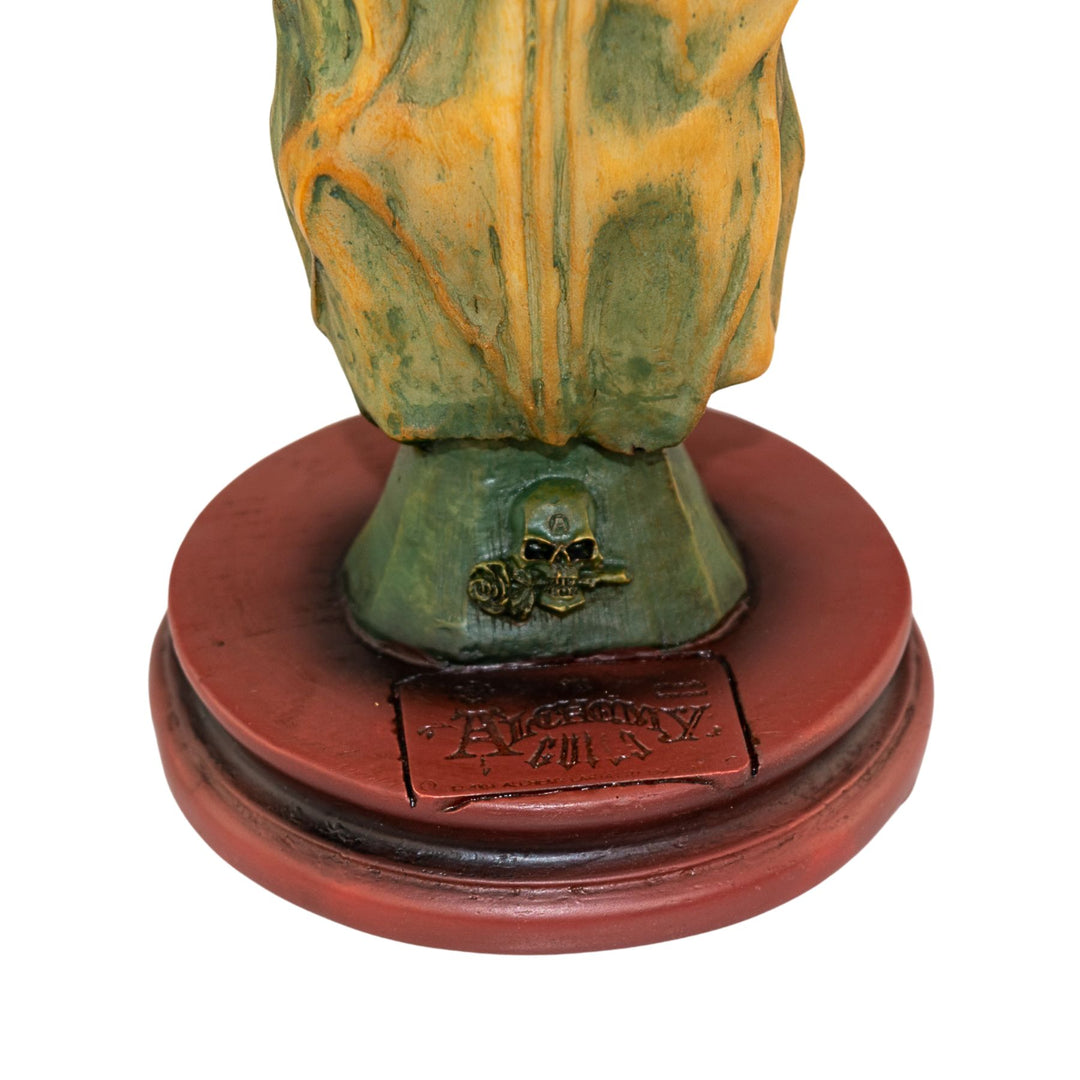 "Decorative object with a green and orange top and red base on a white background," - Up N Smoke.
