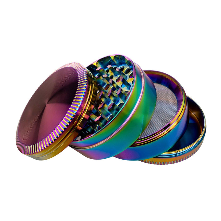 "Anodized 4-Piece Grinder with its compartments splayed out on a white background," - Up N Smoke.