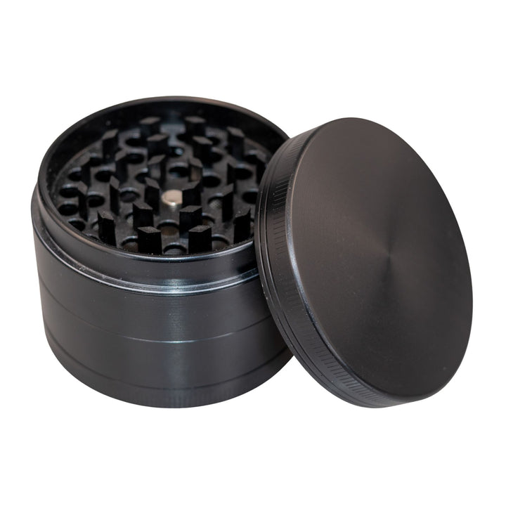 "Black Classic 4-Piece Grinder with the lid propped up against the rest of the tool," - Up N Smoke.