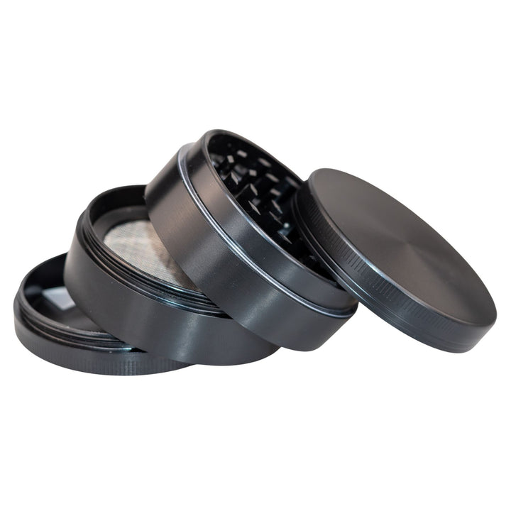 "Black Classic 4-Piece Grinder with each compartment separated and stacked upon one another," - Up N Smoke.