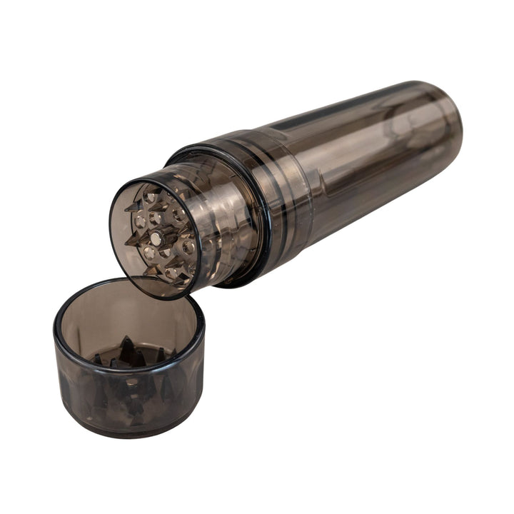 "Black Cookies Flower Tower propped up against the lid, showcasing the magnetic closure and grinding teeth at the top," - Up N Smoke.