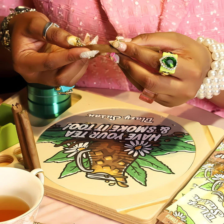 "A styled shoot of feminine hands adorned with stylish jewelry rolling a Blazy Susan Tea Leaf Wrap." - Up N Smoke.