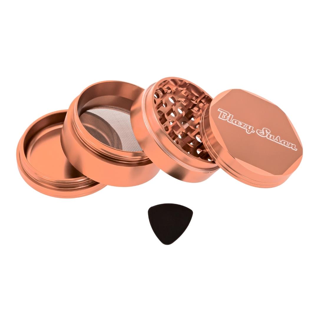 Blazy Susan 4 Piece Rose Gold Grinder showcasing different compartments and accessory displayed on a white background - Up N Smoke