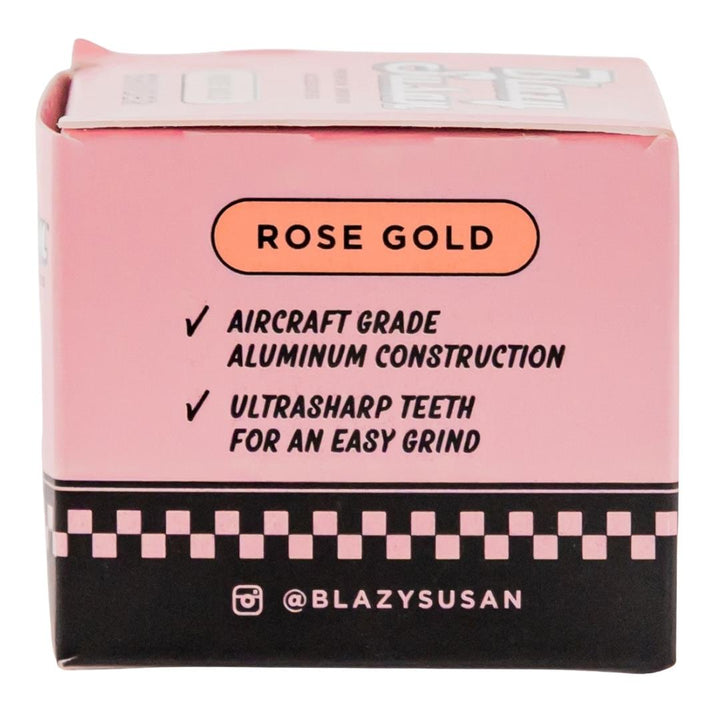 Blazy Susan 4 Piece Rose Gold Grinder showcasing side of packaging displayed on a white background - Up N Smoke