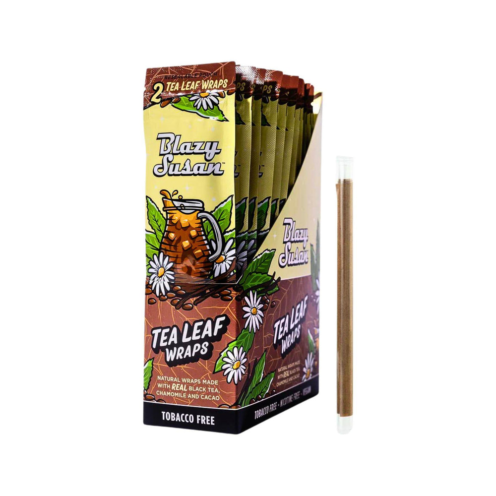 "Studio photograph of an entire case of Blazy Susan Tea Leaf Wraps, next to one of the wraps outside of its packaging. Each pack contains two tea leaf wraps for $1.99." - Up N Smoke.