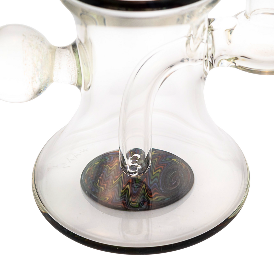 "Close-up of the bottom of a Boss Haas Wig Wag Rig that features the diffused fixed inline and a colorful rainbow design," - Up N Smoke.