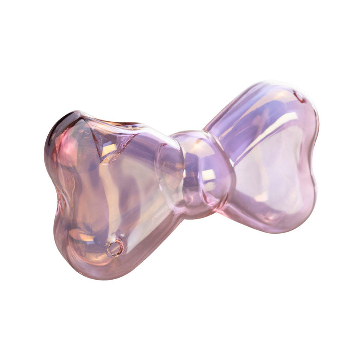 "Iridescent pink glass hand pipe shaped like a bow, with a stylish, delicate design and smooth finish. Designed by Go Easy, a queer and woman-owned business based out of Texas." - Up N Smoke.