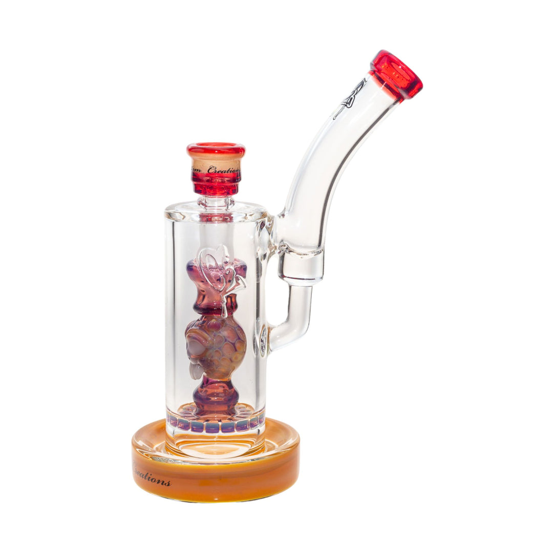 Side left view of a C2 50mm Bubbler. This piece features a ratchet filter, an ornate down stem, and a recessive joint. The colors are hues of orange, purple, and red. - Up N Smoke.
