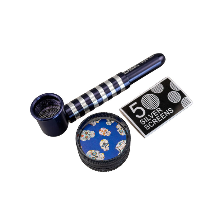 "Indigo D&K Metal Stripe Pipe next to the included two-piece grinder and a package of five silver screens," - Up N Smoke.