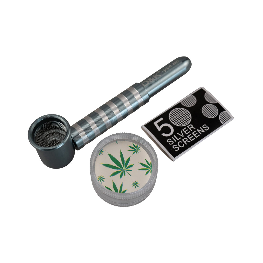 "Teal D&K Metal Stripe Pipe next to the included two-piece grinder and package of five silver screens," - Up N Smoke.