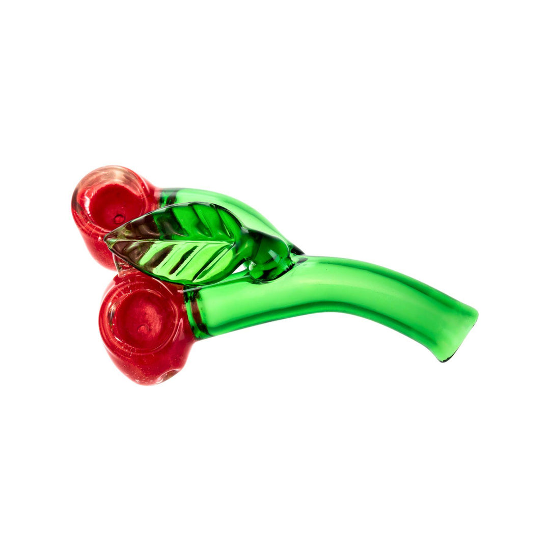 "A 5.5-inch glass hand pipe shaped like two cherries, featuring a double cherry design with a carb on the left side. Both cherries are functional, with smooth red glass and green stems, offering a playful yet practical smoking accessory." - Up N Smoke.