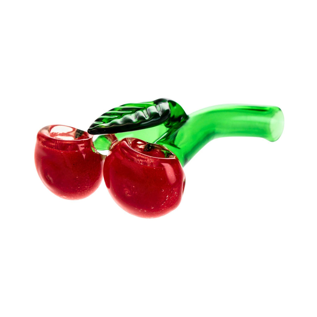 "A glass hand pipe measuring 5.5 inches, featuring a double cherry design with red cherries and green stems. Both cherries are fully functional, with a carb on the left side, offering a fun and unique smoking experience." - Up N Smoke.