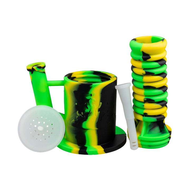 "Green and yellow Expandable Silicone Water Pipe with all of its compartments separated on a white background," - Up N Smoke.