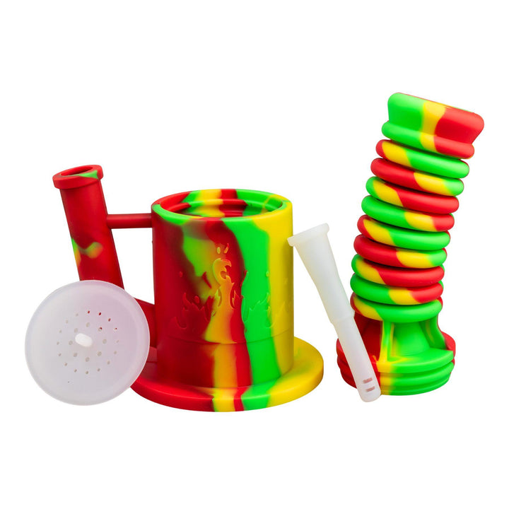 "Rasta Expandable Silicone Water Pipe with all of its compartments separated on a white background," - Up N Smoke.