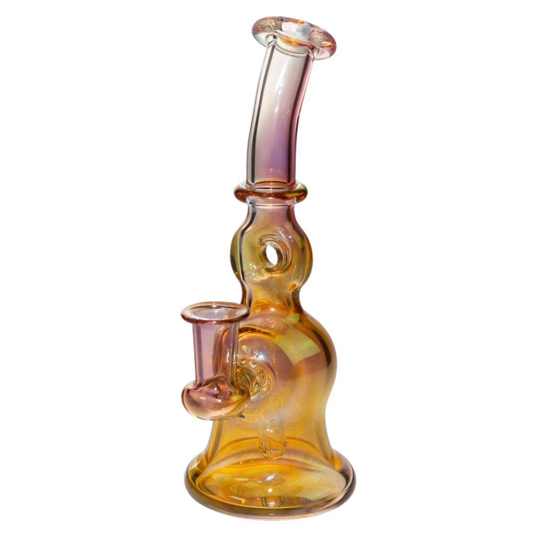 Frank Plays is a glass blowing company that specializes in fumed rigs. Fumed pieces change color with continued usage. This particular piece has a donut recycler underneath the mouth piece that aids in functionality, smoothing out hits. - Up N Smoke.