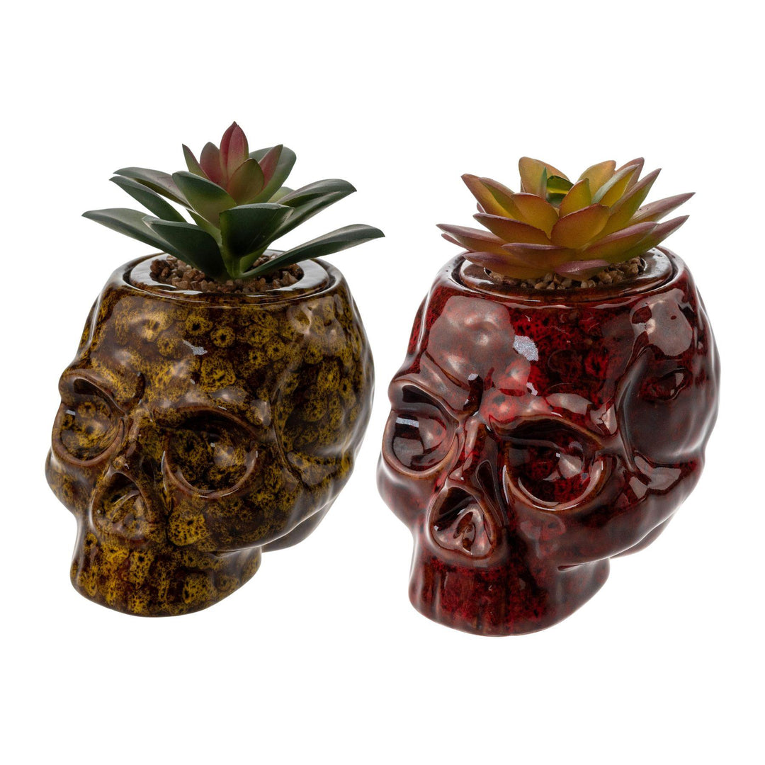 "Two vibrant ceramic Fujima Skull Planter Stash Jars on a white background," - Up N Smoke.