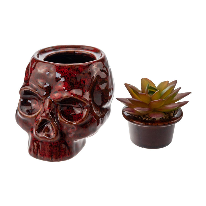 "Red ceramic Fujima Skull Planter Stash Jar with its lid removed on a white background," - Up N Smoke.