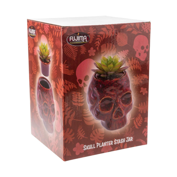 "Box of a red Fujima Skull Planter Stash Jar on a white background," - Up N Smoke.