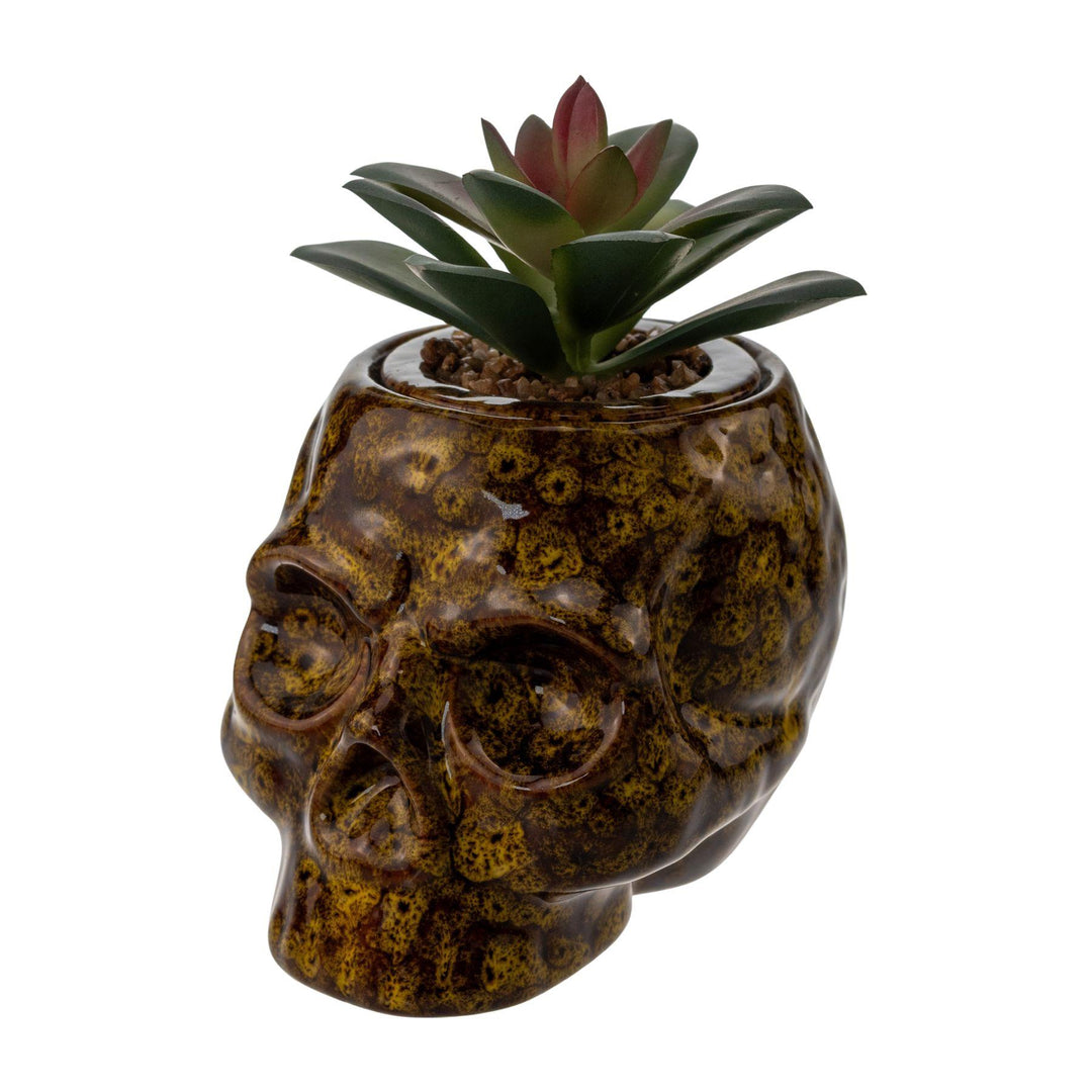 "Yellow ceramic Fujima Skull Stash Jar on a white background," - Up N Smoke.