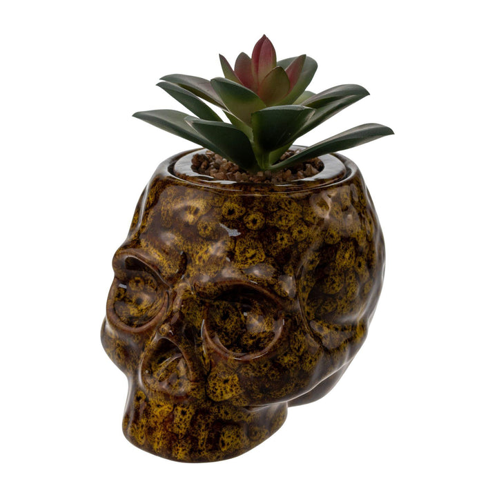 "Yellow ceramic Fujima Skull Stash Jar on a white background," - Up N Smoke.