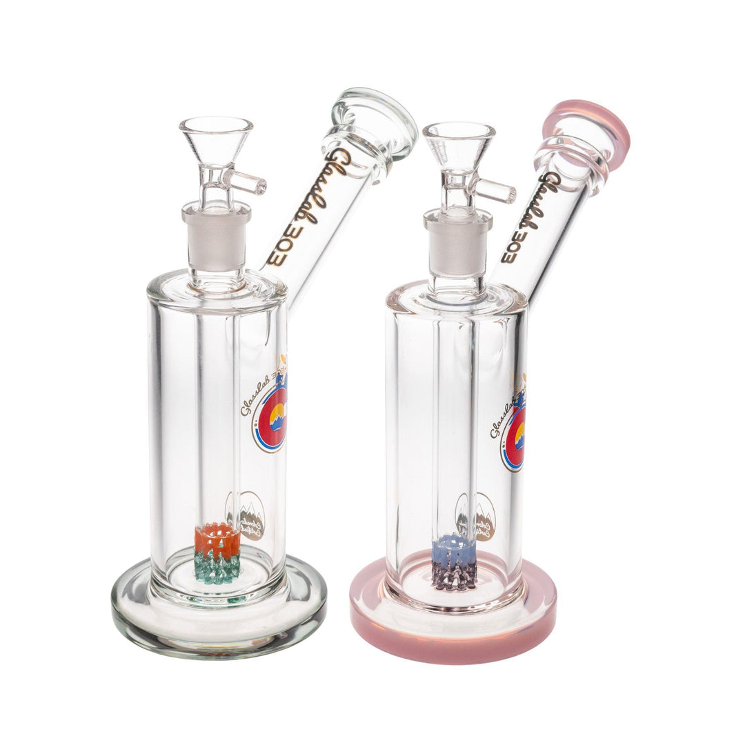 "Group of two Glass Lab 303 Skinny 51 Water Pipes in the variations Smoky and Pink on a white background," - Up N Smoke.