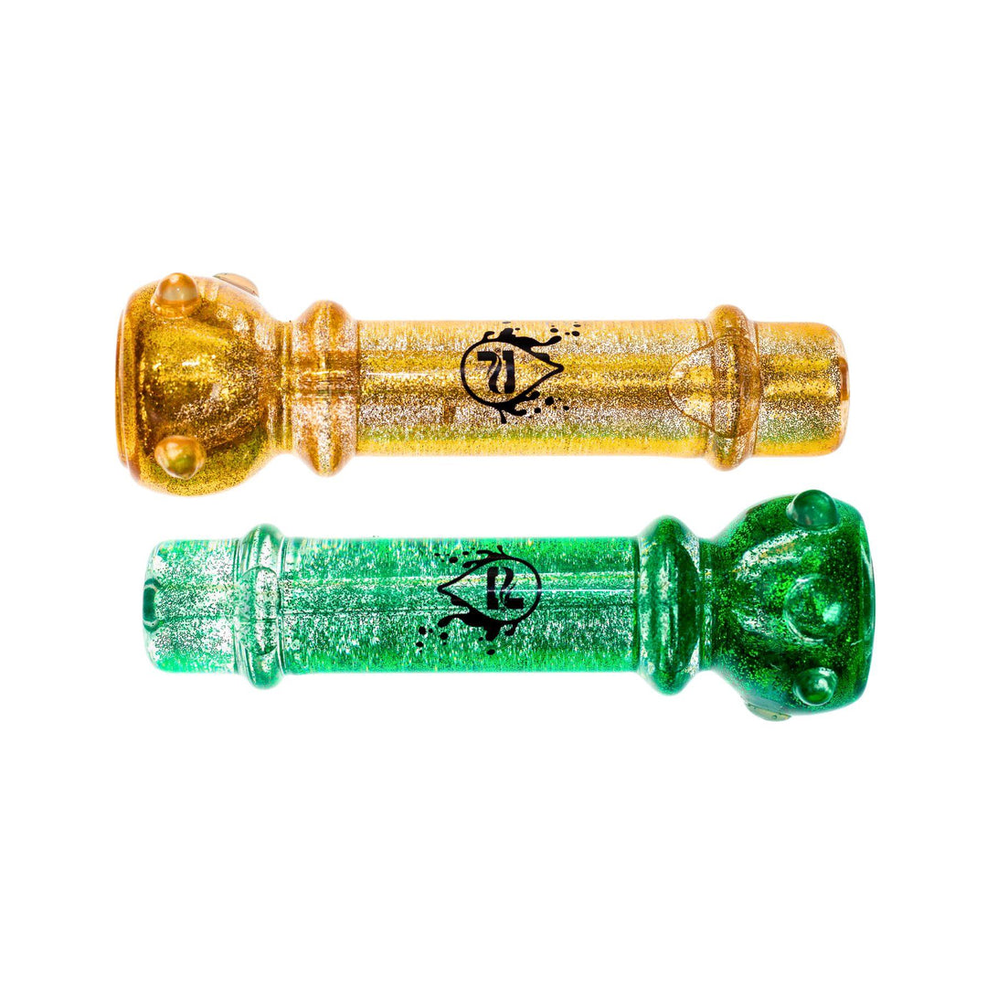 "Two Pulsar glycerin glitter chillums, one in shimmering gold and the other in glittering green. Both chillums feature a compact, cylindrical design with a black Pulsar logo. The glycerin-filled interior enhances the glitter effect, making these chillums visually striking. Perfect for a smooth, cool smoking experience." - Up N Smoke.