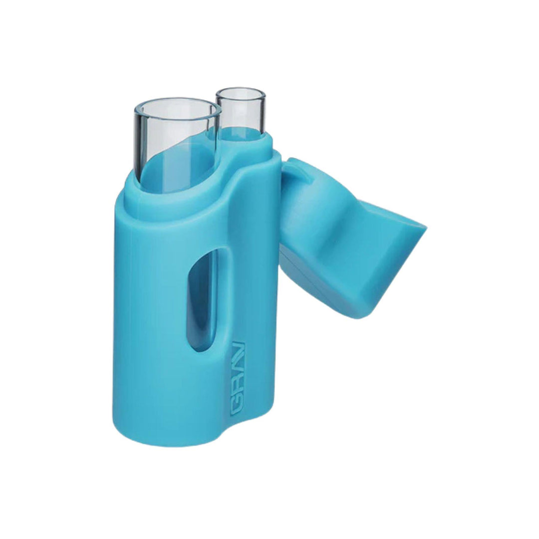 "A teal Grav Labs Silicone Dugout tilted at an angle with the case open at its hinge," - Up N Smoke.