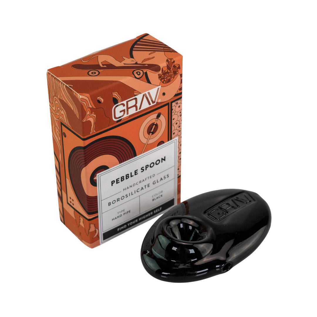 "Black pebble spoon with 'GRAV' branding next to its packaging on a white background," - Up N Smoke.