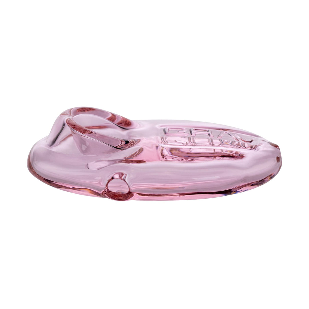 "Left side of a Grav Labs Pebble Spoon in the color variation pink on a white background," - Up N Smoke.