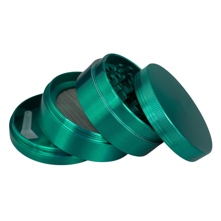 "Green Classic 4-Piece Grinder with its compartments all separated and stacked upon one another," - Up N Smoke.