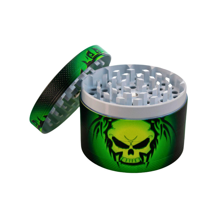 "Green and black skull grinder with white teeth and four compartments on a white background," - Up N Smoke.