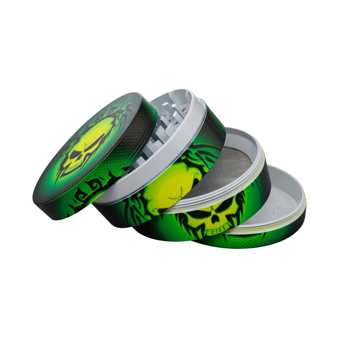 "Four-piece grinder splayed out, showcasing all chambers on a white background," - Up N Smoke.