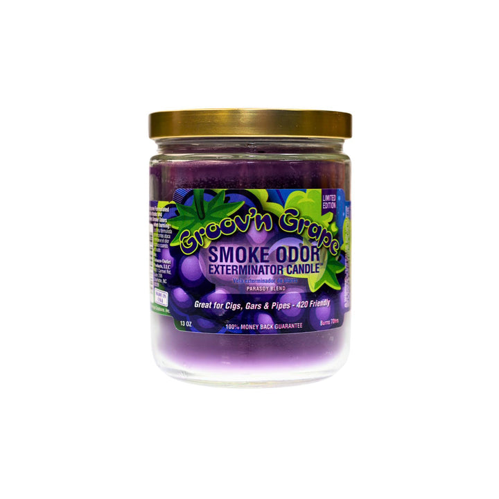  "Close-up of the Groov'n Grape Smoke Odor Exterminator Candle. The jar features a vibrant label with grape-themed graphics and bold colors. The candle inside has a deep purple wax, and the label highlights its fruity grape fragrance, perfect for eliminating smoke and other odors." - Up N Smoke.