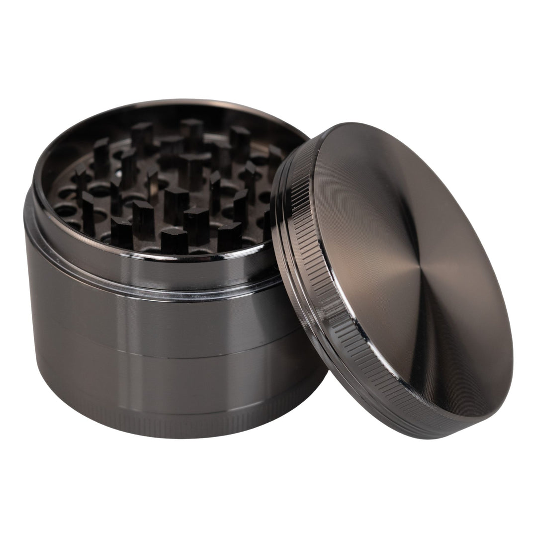 "Gunmetal Classic 4-Piece Grinder with its lid propped up against the rest of the tool," - Up N Smoke.