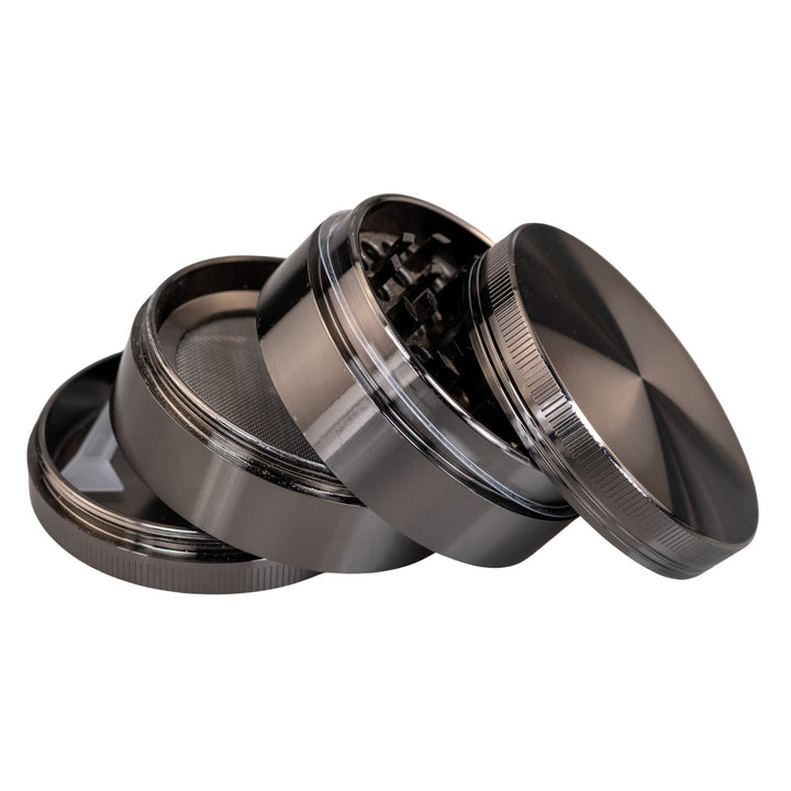 "Gunmetal Classic 4-Piece Grinder with all four compartments separated and stacked upon one another," - Up N Smoke.