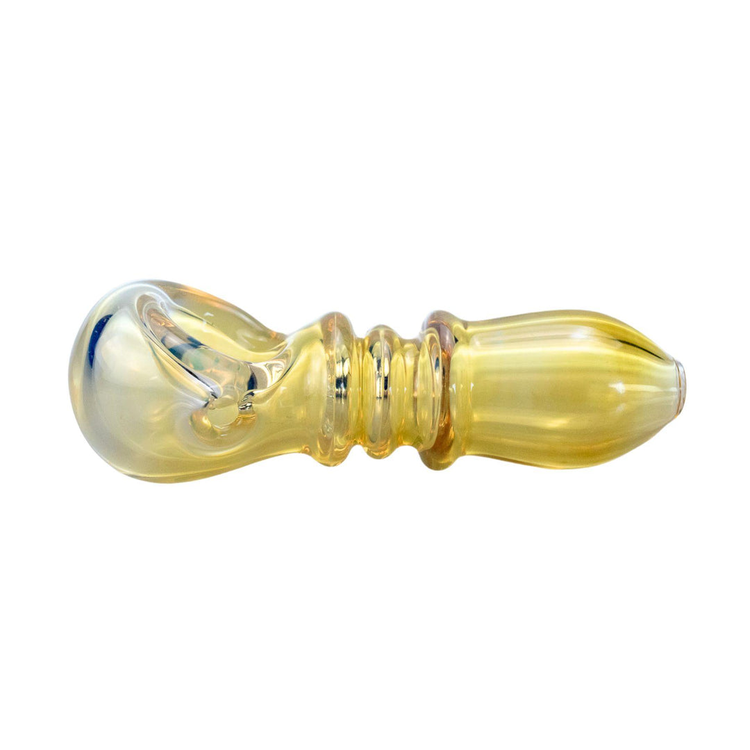 "Close-up of a 3.5-inch handcrafted glass spoon pipe featuring three grip-enhancing ringlets and a vibrant gold-fumed design." - Up N Smoke.