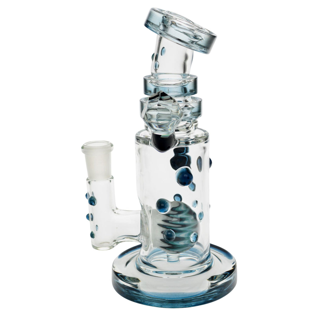 "Left side of a blue Hubbard Rig that has an intricate wig-wag marble within the interior," - Up N Smoke.