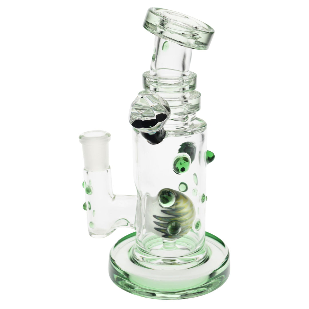 "Left side of a green Hubbard Rig that has a wig-wag marble within the interior," - Up N Smoke.