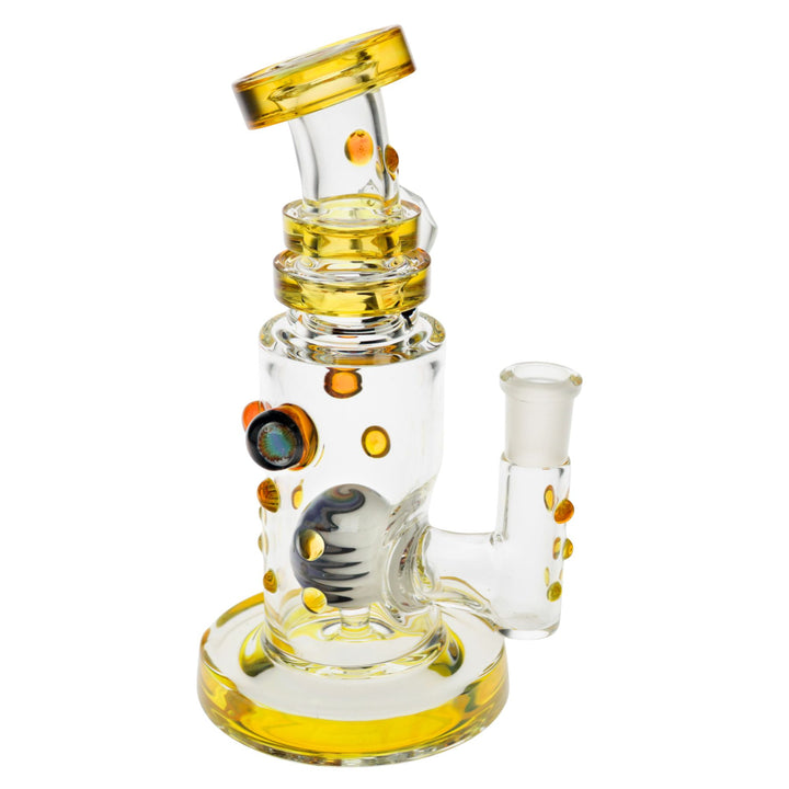 "Side angle of a yellow Hubbard Rig with an intricate wig-wag marble within the interior," - Up N Smoke.