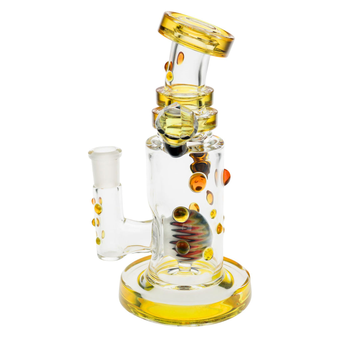 "Left side of a yellow Hubbard Rig with an intricate wig-wag marble within the interior," - Up N Smoke.