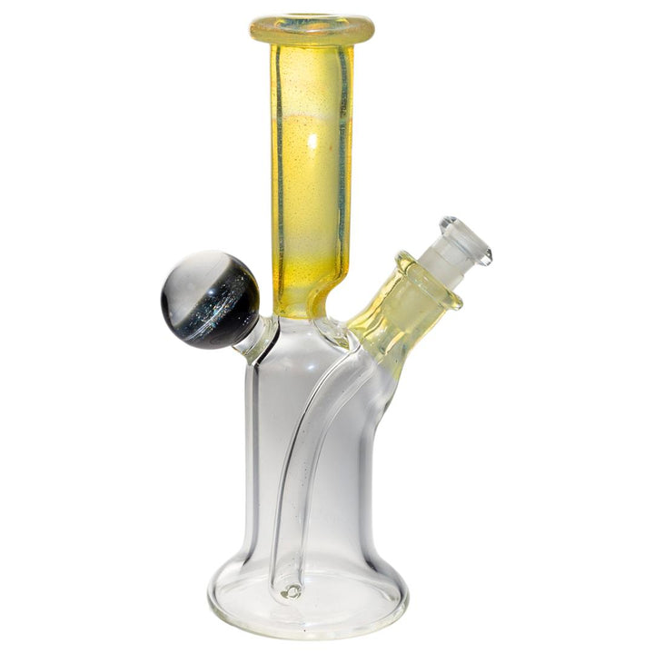 Right side profile of a yellow Jack Glass rig. This piece features a unique marble on the back that is packed with dimension and color. - Up N Smoke.