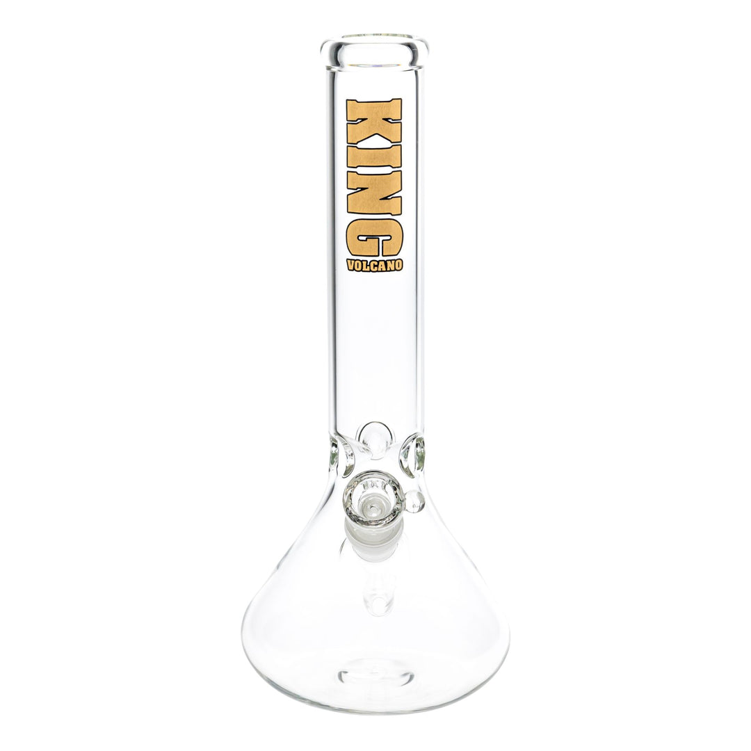 "Front view of a clear glass King Volcano 44mmx12'' Beaker that has a gold logo near the mouthpiece and features a three-prong ice pinch," - Up N Smoke.
