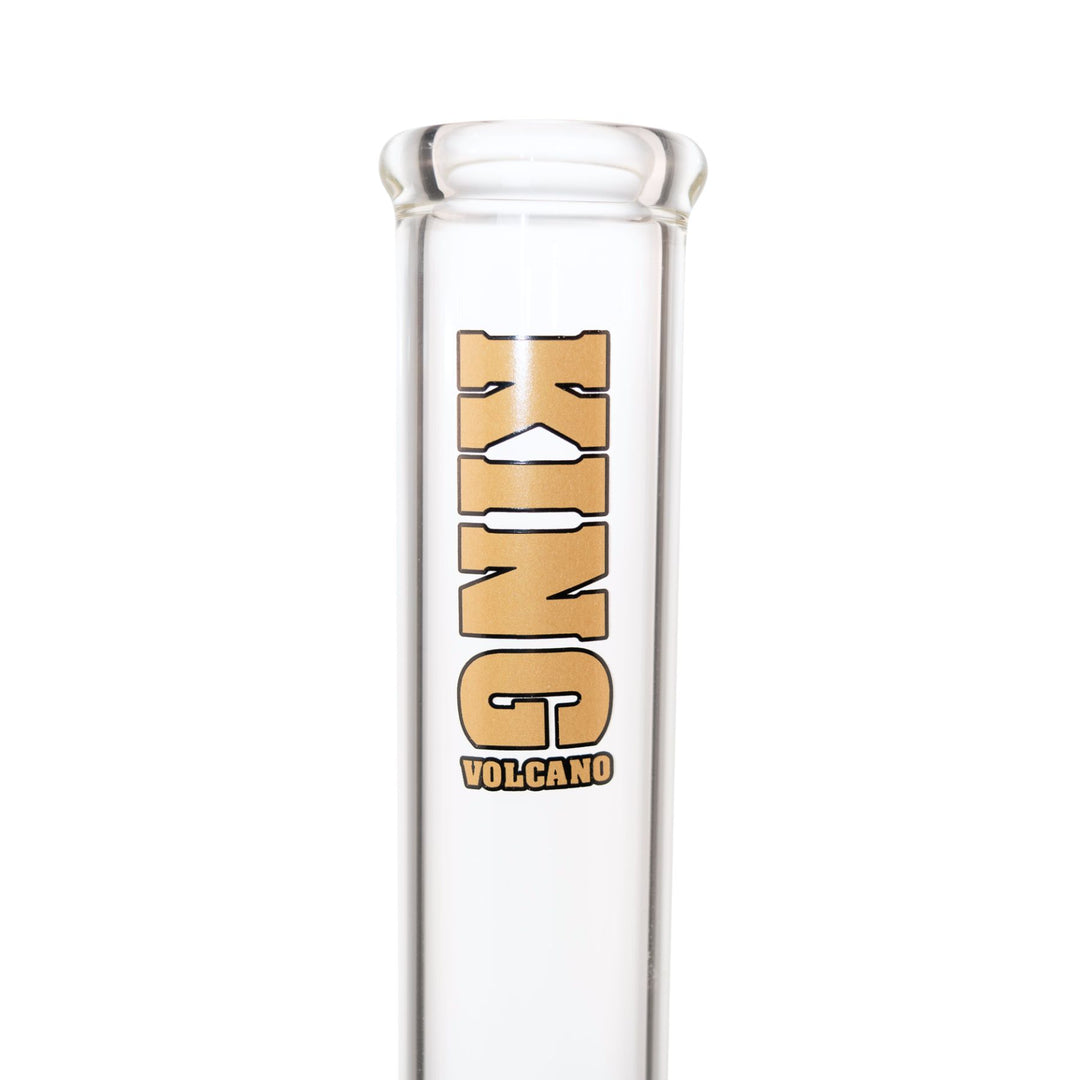 "Close-up view of the gold King Volcano logo near the mouthpiece of a 50mmx15in Beaker," - Up N Smoke.