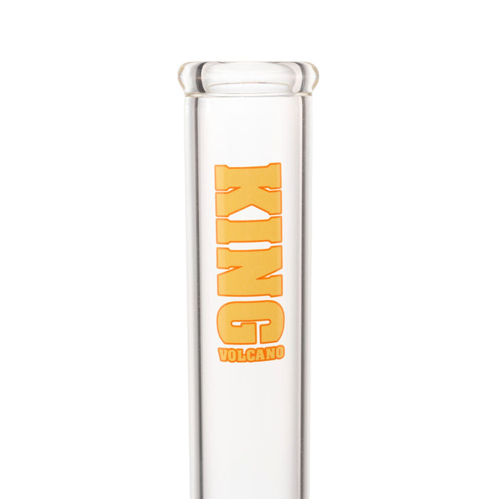 "Close-up view of a yellow King Volcano logo near the mouthpiece of a 50mmx15in Beaker on a white background," - Up N Smoke.