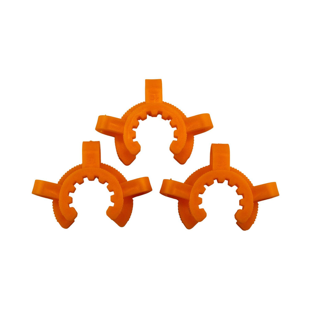 "Three orange Keck Clips on a white background," - Up N Smoke.