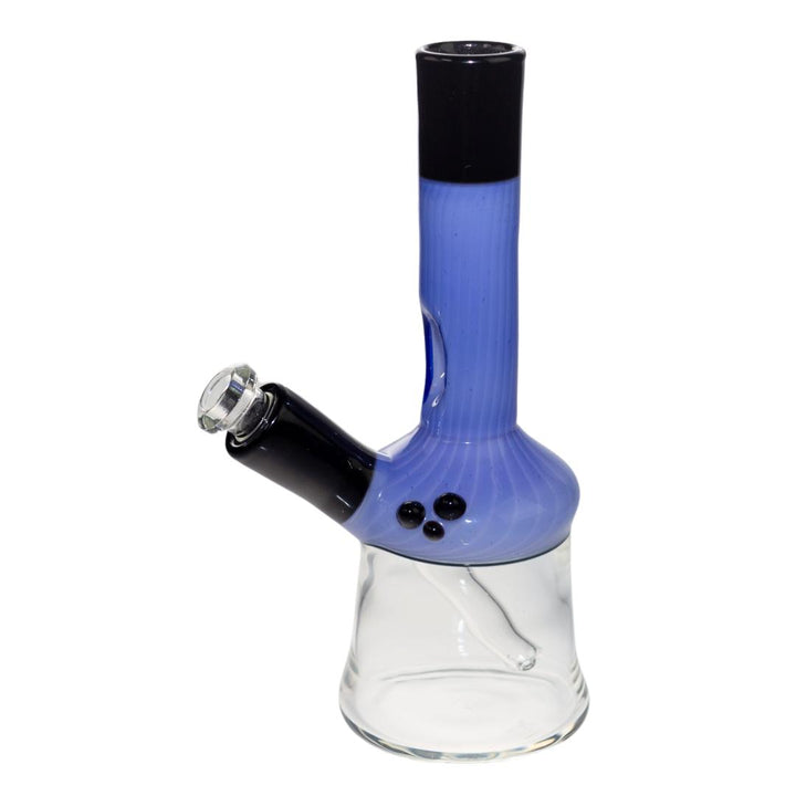 Left side of a King Leo water pipe. This beaker features a purple and black body with a clear base. It has three black decorative bubbles on its left side. - Up N Smoke.