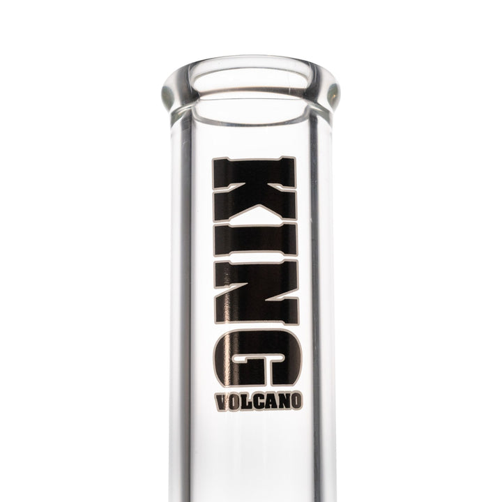 "Close-up view of a black King Volcano logo on a clear beaker against a white background," - Up N Smoke.