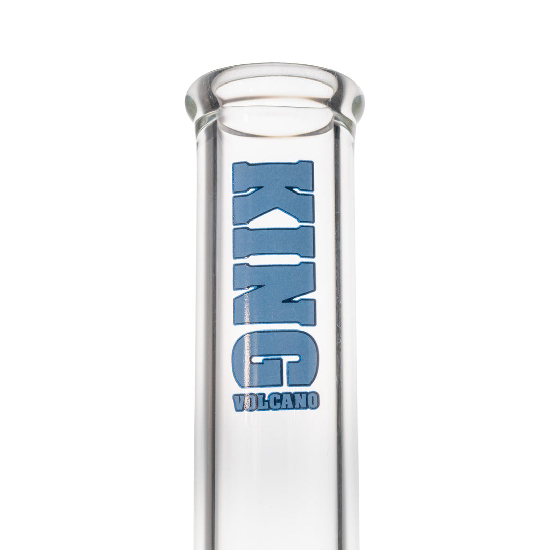 "Close-up of a light blue King Volcano logo on a clear beaker," - Up N Smoke.